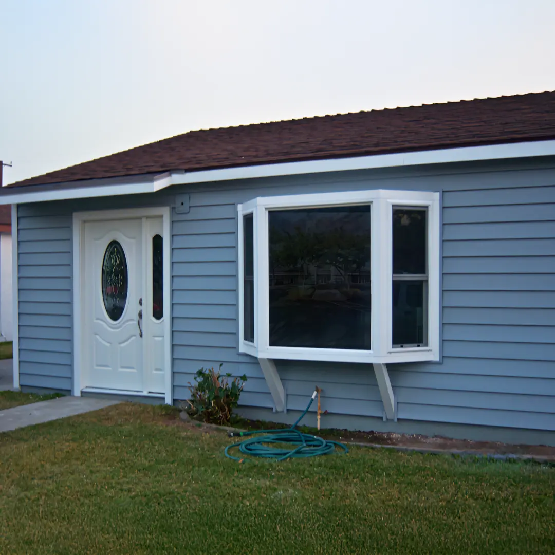 A full color 1080x1080 webp image of bay and bow windows installed by CAT Exteriors.