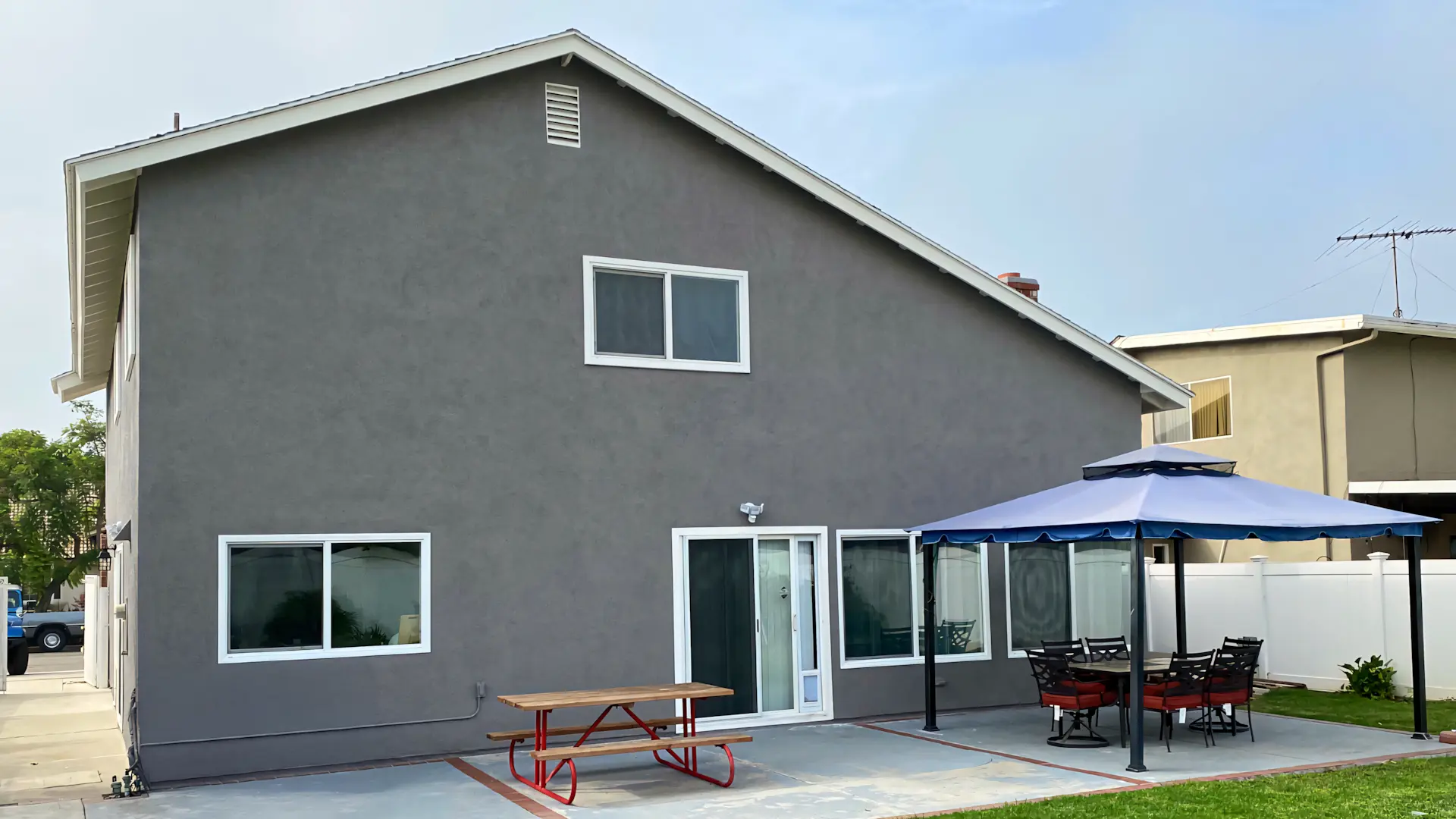 A full color 1920x1080 webp image of a home with a new exterior coating by CAT Exteriors.