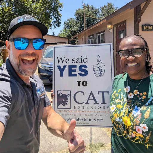 A full color 1080x1080 webp image of a CAT Exteriors representative taking a photo with a happy client at their home.