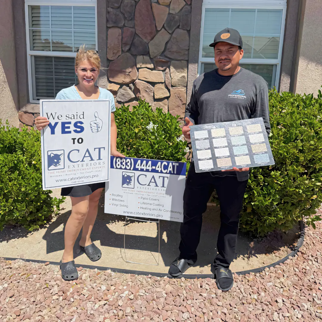 A full color 1080x1080 webp image of a happy CAT Exteriors client in front of their home.