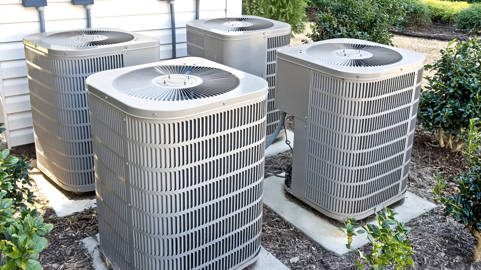 A full color 1920x1080 webp image of CAT Exteriors HVAC installation featuring four outdoor units on a property.