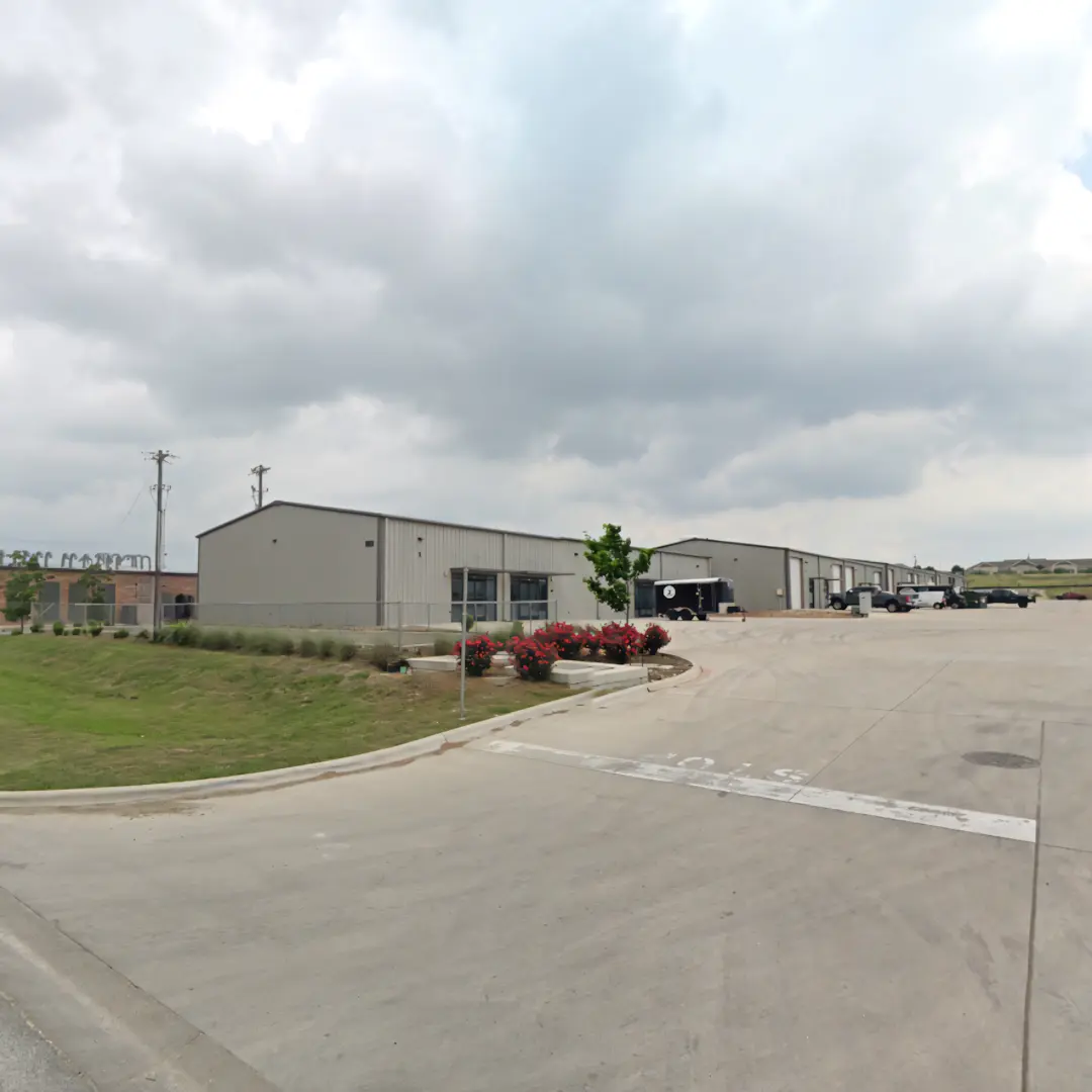 A full color 1080x1080 webp image of CAT Exteriors' office in Kyle, Texas.