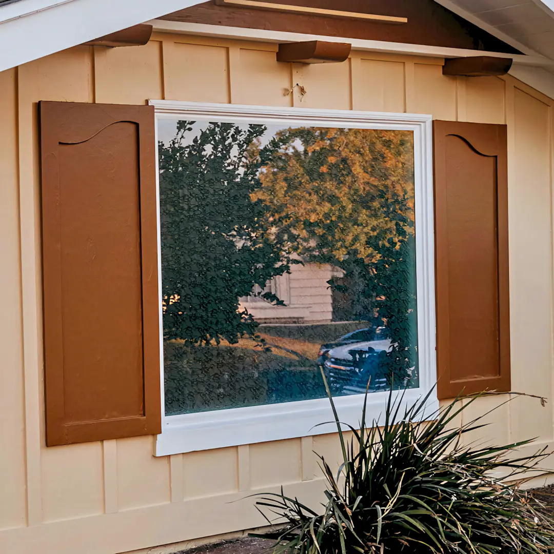 A full color 1080x1080 webp image of picture windows installed by CAT Exteriors.