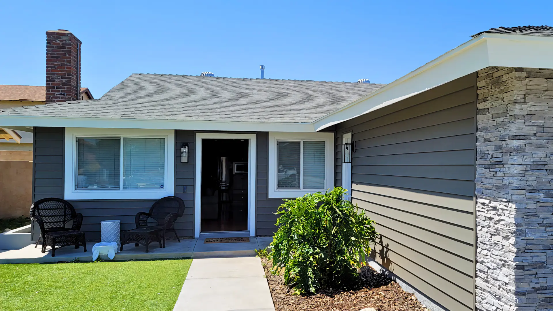 A full color 1920x1080 webp image of a home with newly installed siding by CAT Exteriors.