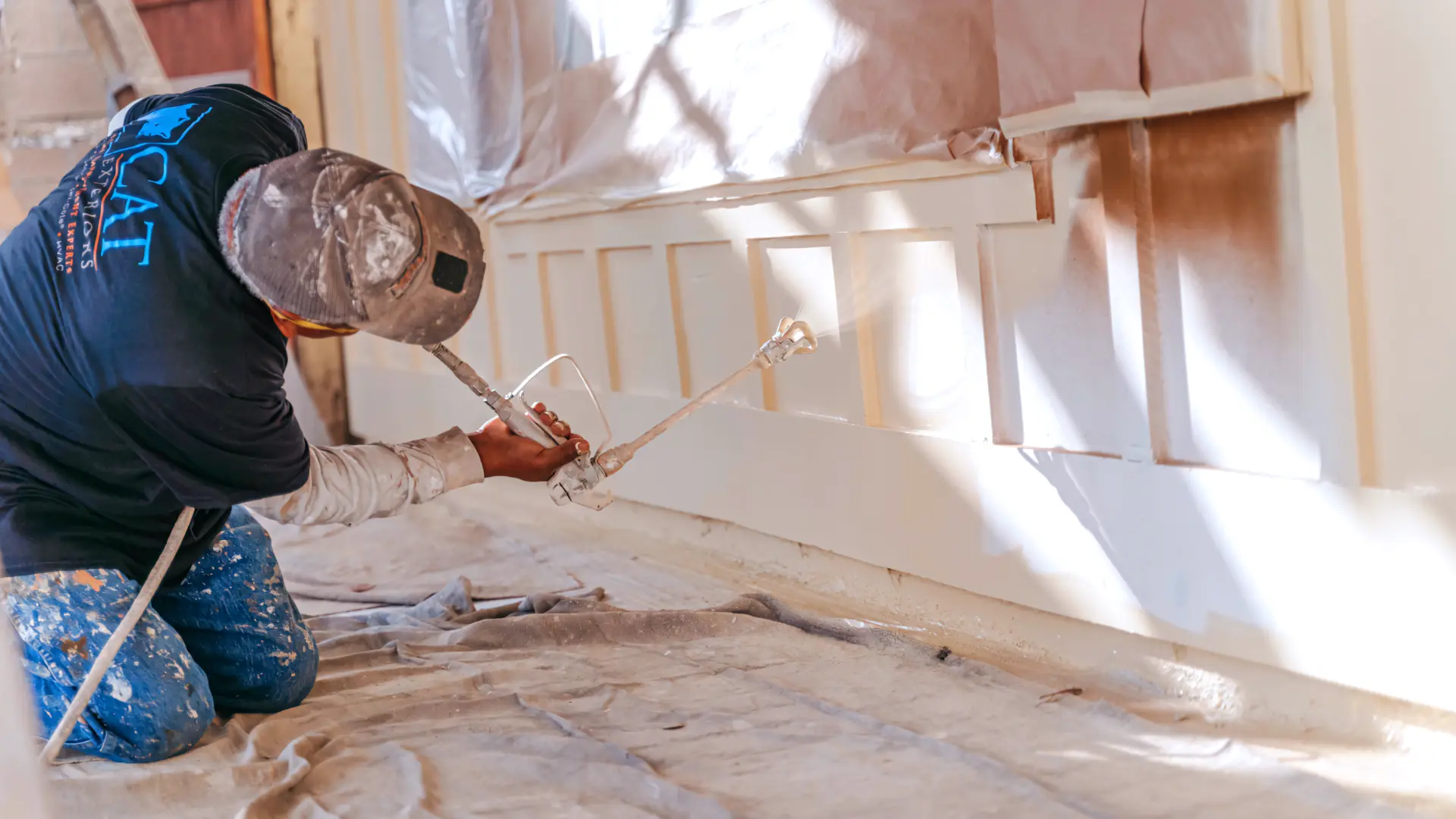 A full color 1920x1080 webp image of Tex–Cote exterior coating being applied to a home's exterior by CAT Exteriors.