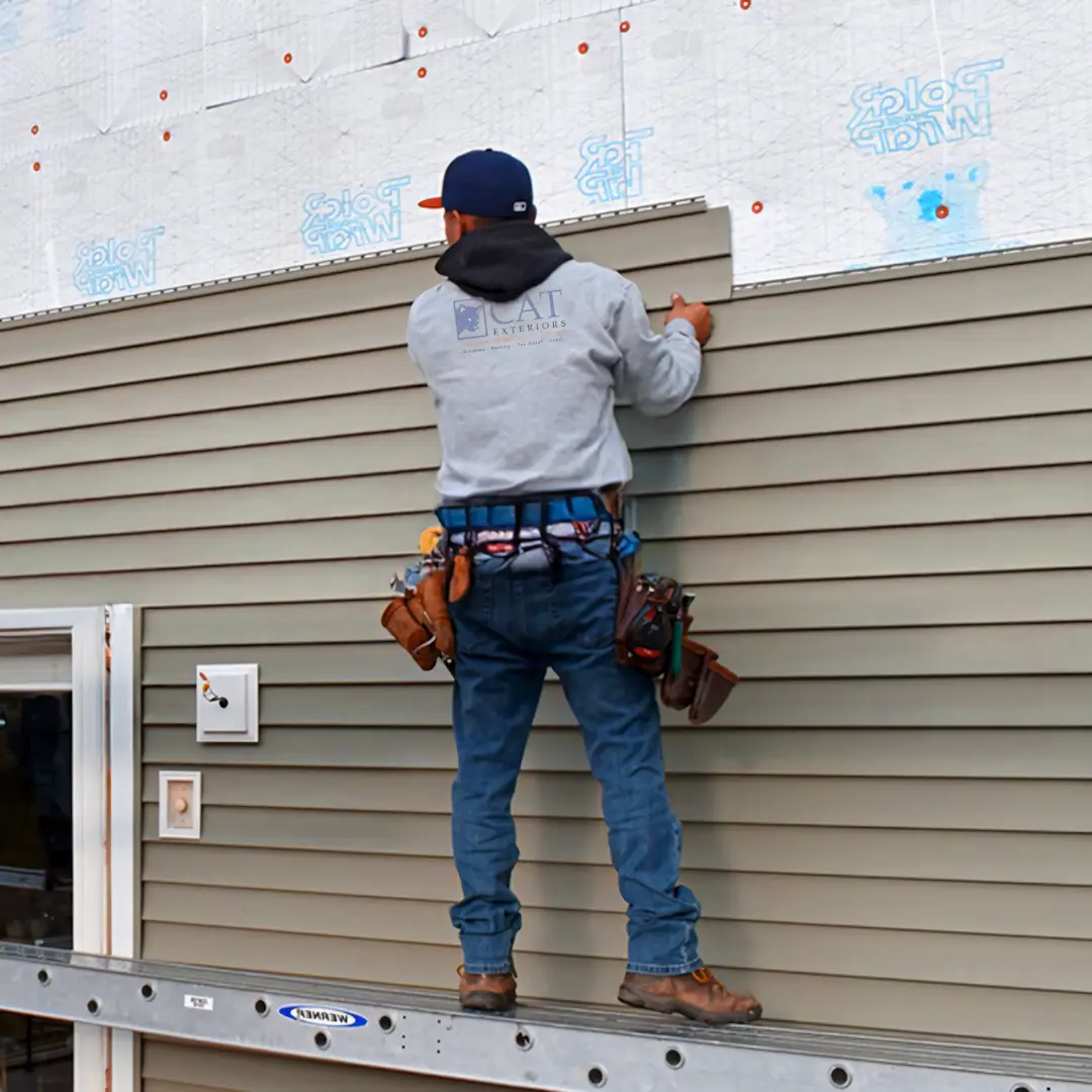 A full color 1080x1080 webp image of CAT Exteriors vinyl siding service.