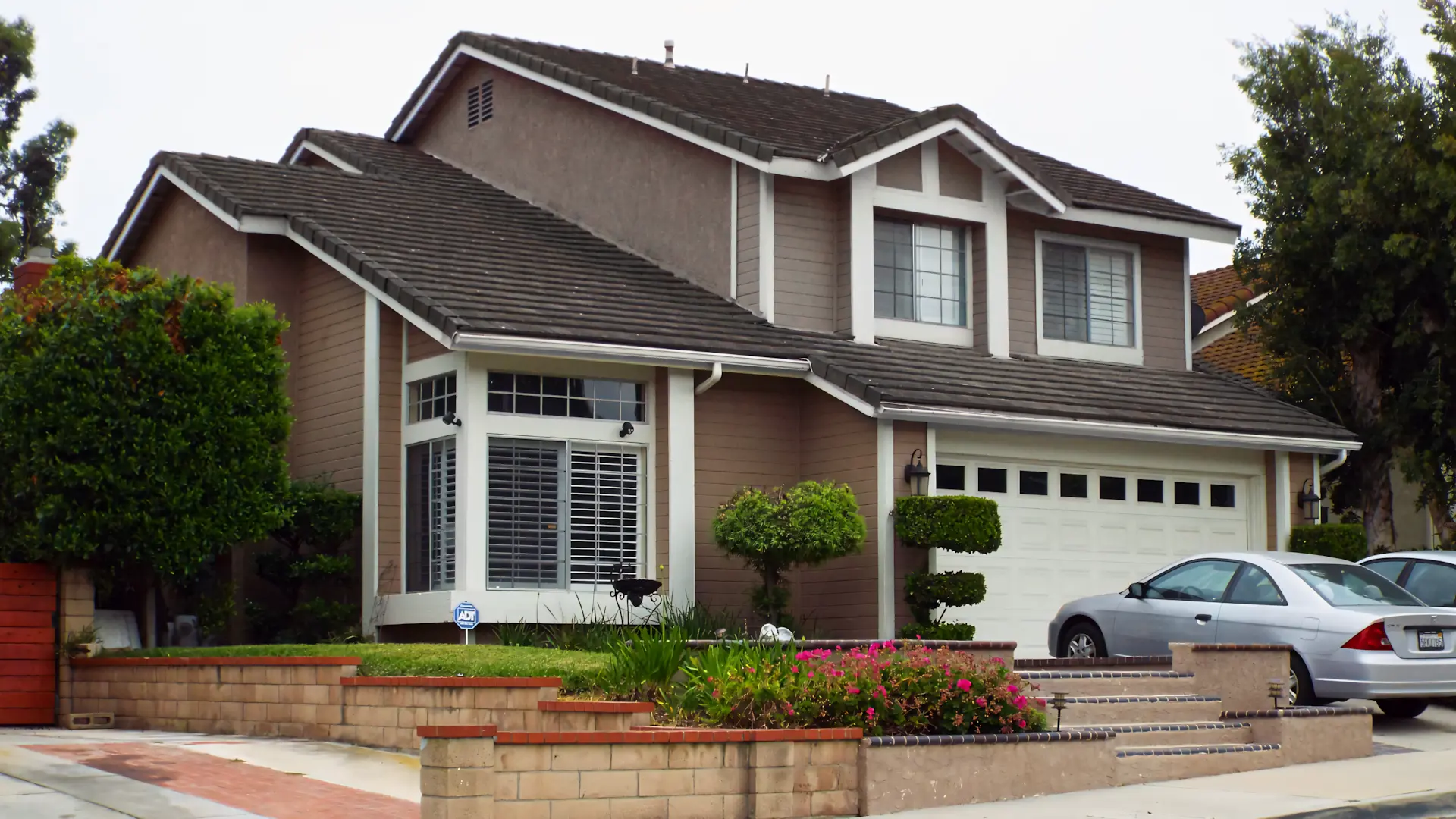 A full color 1920x1080 webp image of a completed window replacement project by CAT Exteriors.