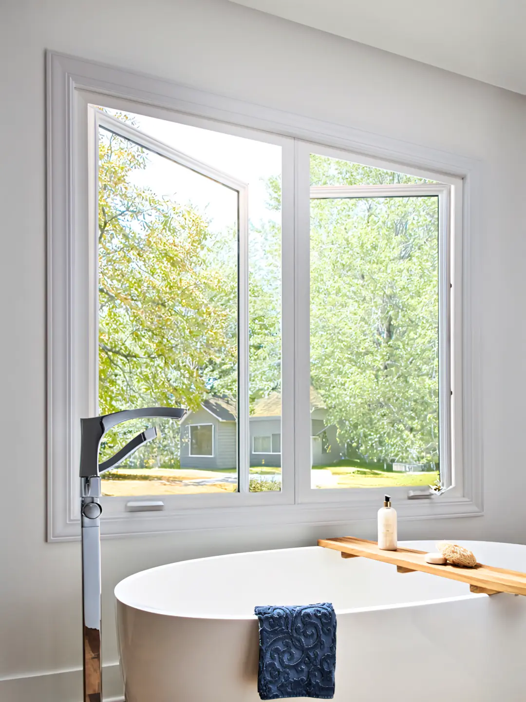 A full color 1080x1440 webp image of a completed casement window installation by CAT Exteriors.