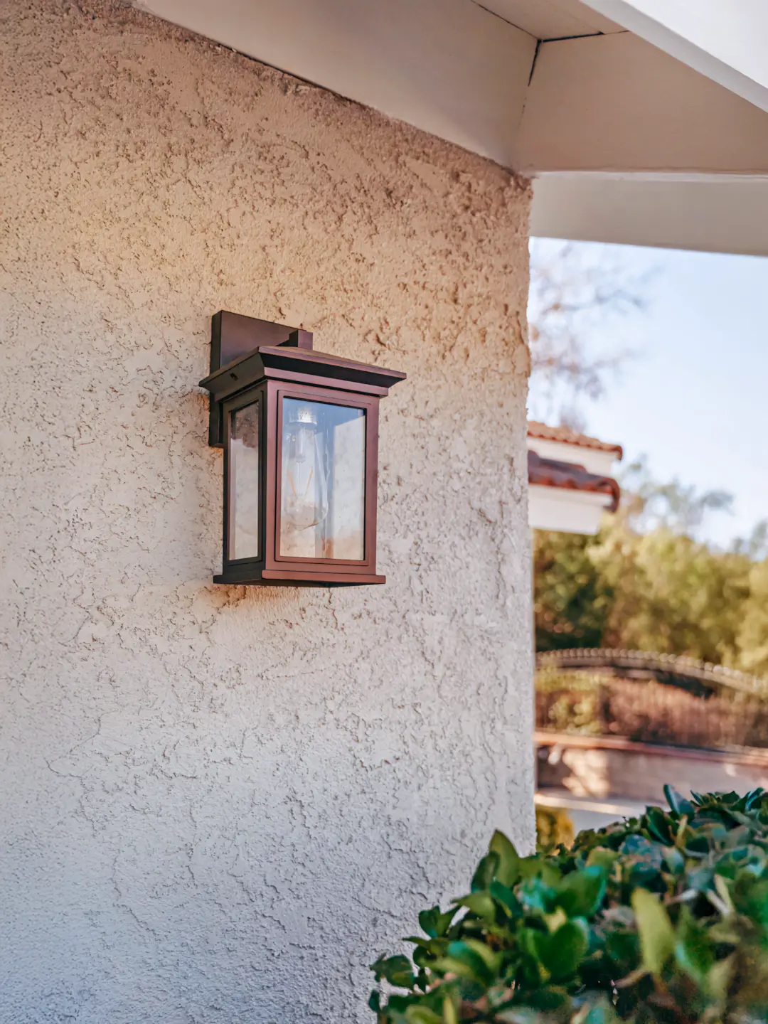 A full color 1080x1440 webp image showing a wall with CAT Exteriors Tex–Cote Coolwall coating applied.