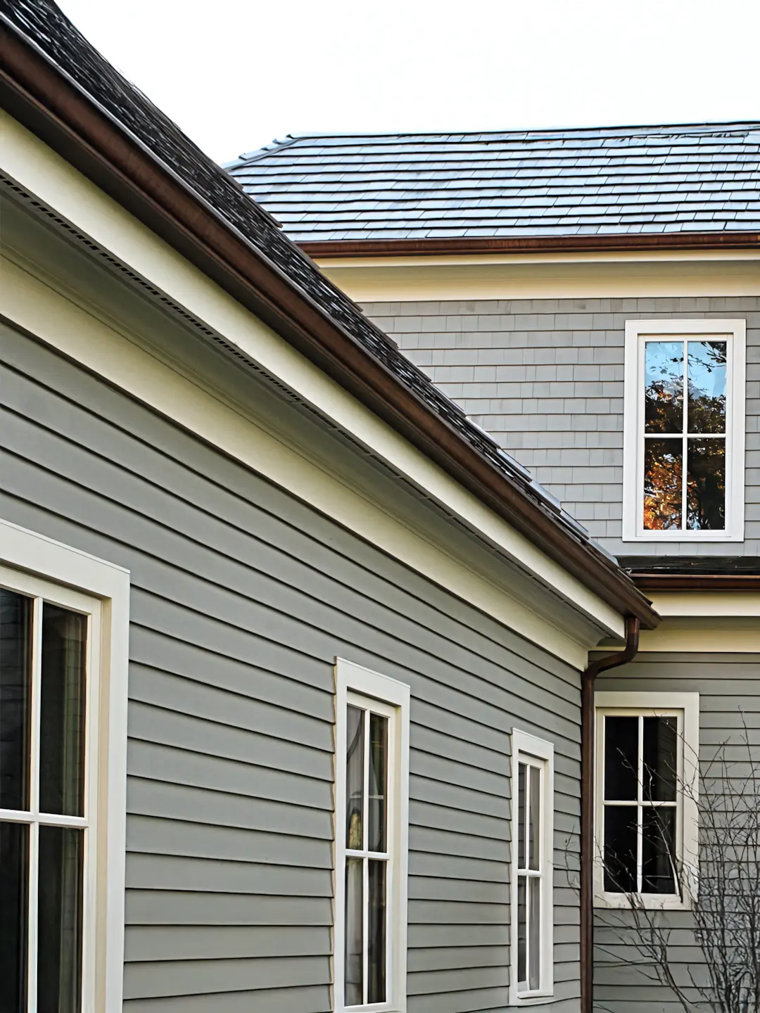 A full color 1080x1440 webp image of a CAT Exteriors completed home featuring various exterior trim pieces.